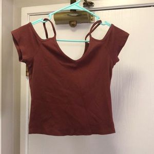 Rust colored top. Off the shoulder crop top. Ribbed material. Size medium.